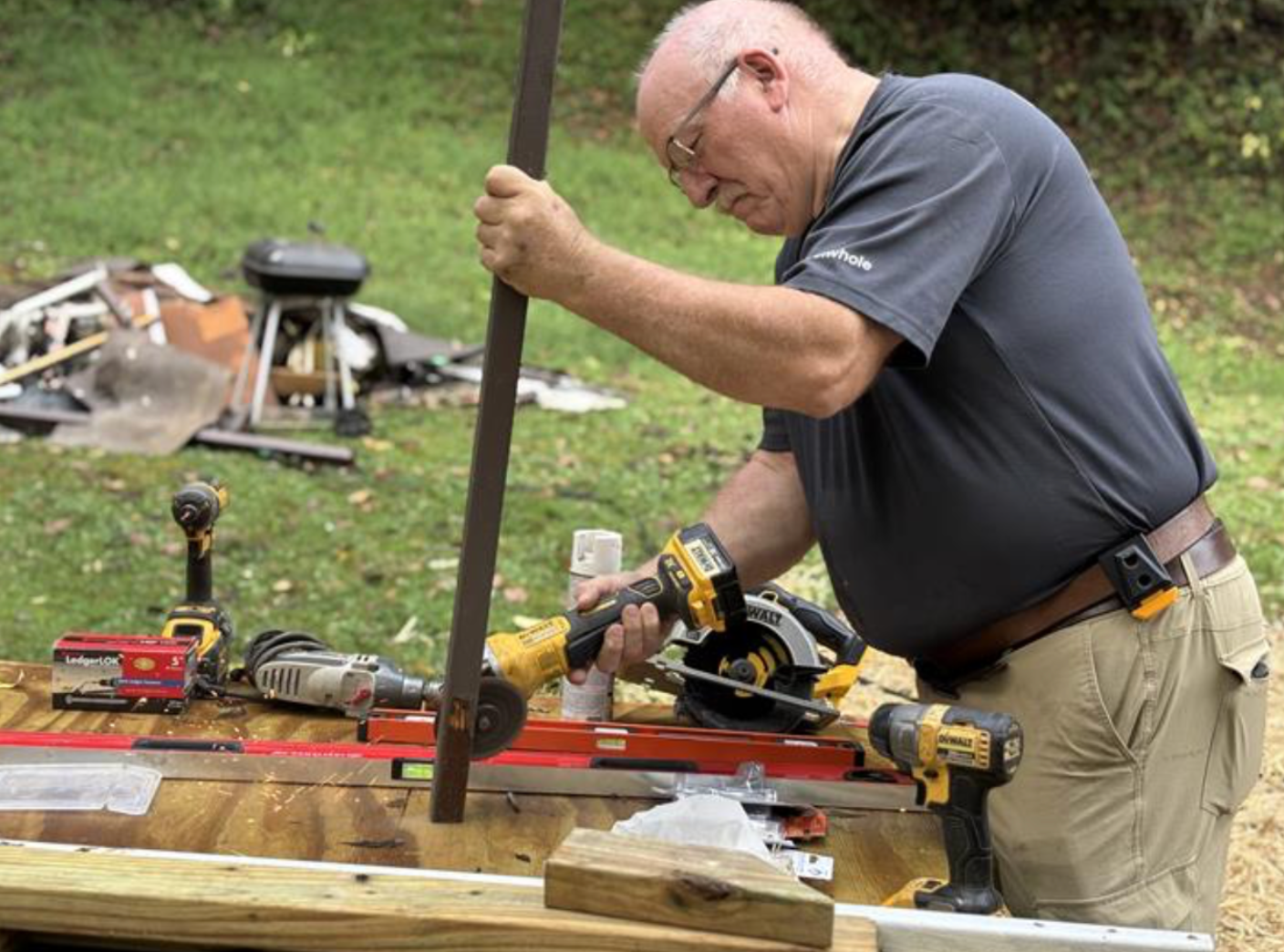 Man using power tools to grind metal